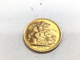 A 1958 full sovereign. Postage A