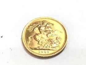 A 1967 full gold sovereign. Postage A