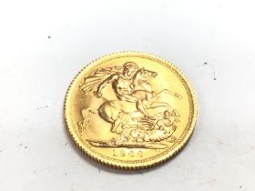 A 1966 full gold sovereign. Postage A