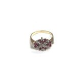 A 9ct gold ruby set cluster ring. 3.2g and P 1/2.