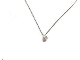 A 9ct white gold diamond pear cut pendant on a whi