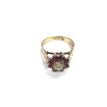 A 9ct gold reverse ruby and diamond set cluster ri