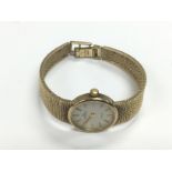 A 9ct gold Garrards quartz bracelet watch, seen wo