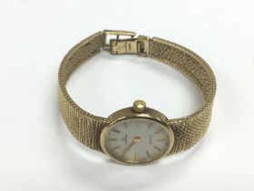 A 9ct gold Garrards quartz bracelet watch, seen wo