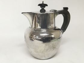 A Scottish silver hot water jug with hinged lid Sc