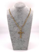 A high carat gold stone set cross with on a fancy