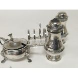 A silver toast rack silver mustard pot and condiments. All with Birmingham hallmarks.