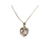 A 9ct multi coloured gold pendant set with white s