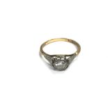 An 18ct gold and platinum diamond set ring. 2.4g a