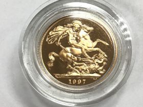 A 1997 gold proof full sovereign with COA Postage