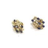 A pair of 18ct gold diamond and sapphire earrings.