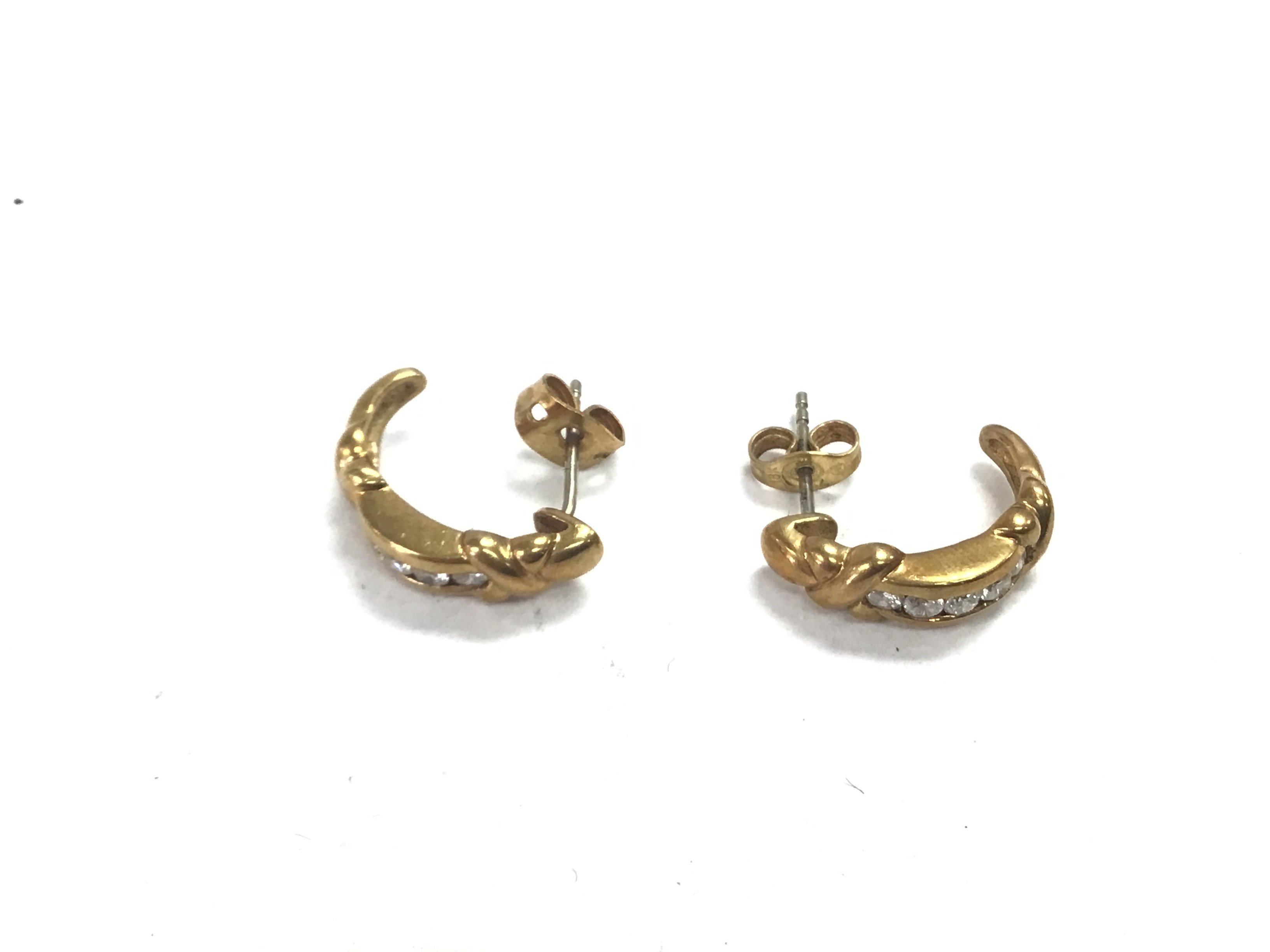 A pair of 18ct gold diamond set earrings. 4.6g tot