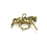 An 18ct gold horse pendant possibly by Harriet Gle