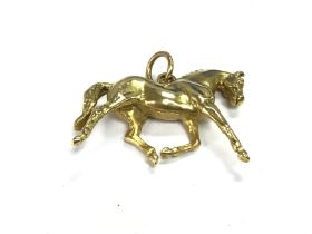 An 18ct gold horse pendant possibly by Harriet Gle