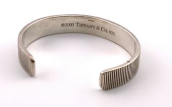 A Tiffany & Co silver coin edge silver cuff bracel