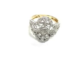A 14ct gold diamond set filigree ring. Size N and