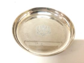 A Garrands silver commemorative dish. Approximately 250g and 12.5cm diameter. Postage B