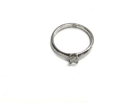 A platinum diamond ring. 2.6g and size L and 0.16