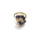 An 18ct gold sapphire and diamond ring. 5.2g and F