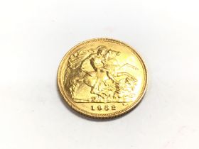 A 1982 half sovereign. Postage A