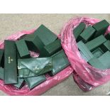 A collection of green Rolex style boxes , postage