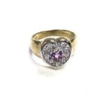 A 9ct amethyst and diamond heart ring. 5.1g and N