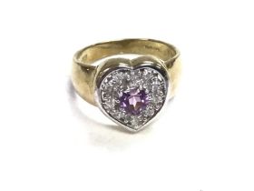 A 9ct amethyst and diamond heart ring. 5.1g and N