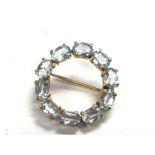 A 9ct gold blue topaz brooch approximately 23mm di