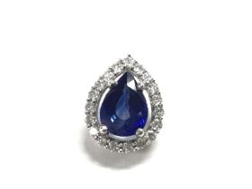 An 18ct Ceylon sapphire and diamond pendant. Appro