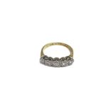 A 14ct gold ring set with 5 diamonds. 2.4g and siz