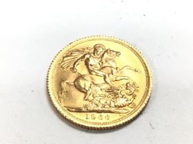 A 1966 full gold sovereign. Postage A