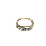 A 9ct gold sapphire and diamond half hoop ring. 2g