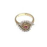 A 9ct gold ruby and diamond set spiral ring. 3.4g