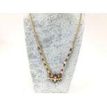 An 18ct gold sapphire and diamond necklace. 17.5g