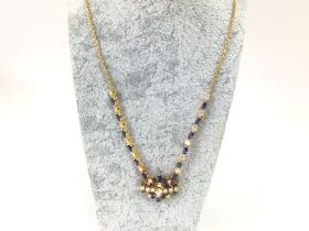 An 18ct gold sapphire and diamond necklace. 17.5g