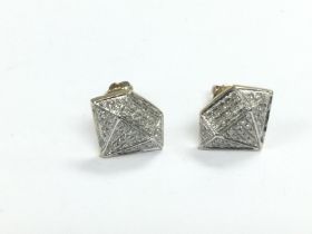 A pair of 10k gold multi diamond set stud earrings