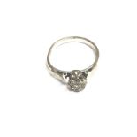 An 18ct white gold ring set with small diamond. Si