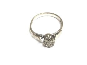 An 18ct white gold ring set with small diamond. Si