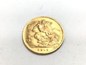 A 1915 half gold sovereign. Postage A.