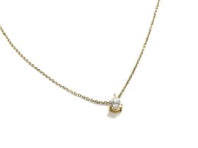 An 9ct gold pear shaped diamond pendant with chain