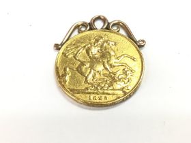 A 1825 double gold sovereign on mount. 16.8gPostag