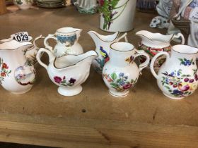 A collection of Royal Worcester jugs decorated with various period patterns. NO RESERVE