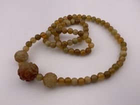 A Chinese hard stone bead necklace. (A)