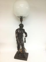 A French spelter figural lamp depicting a miner, approx total height 90cm. Shipping category D.