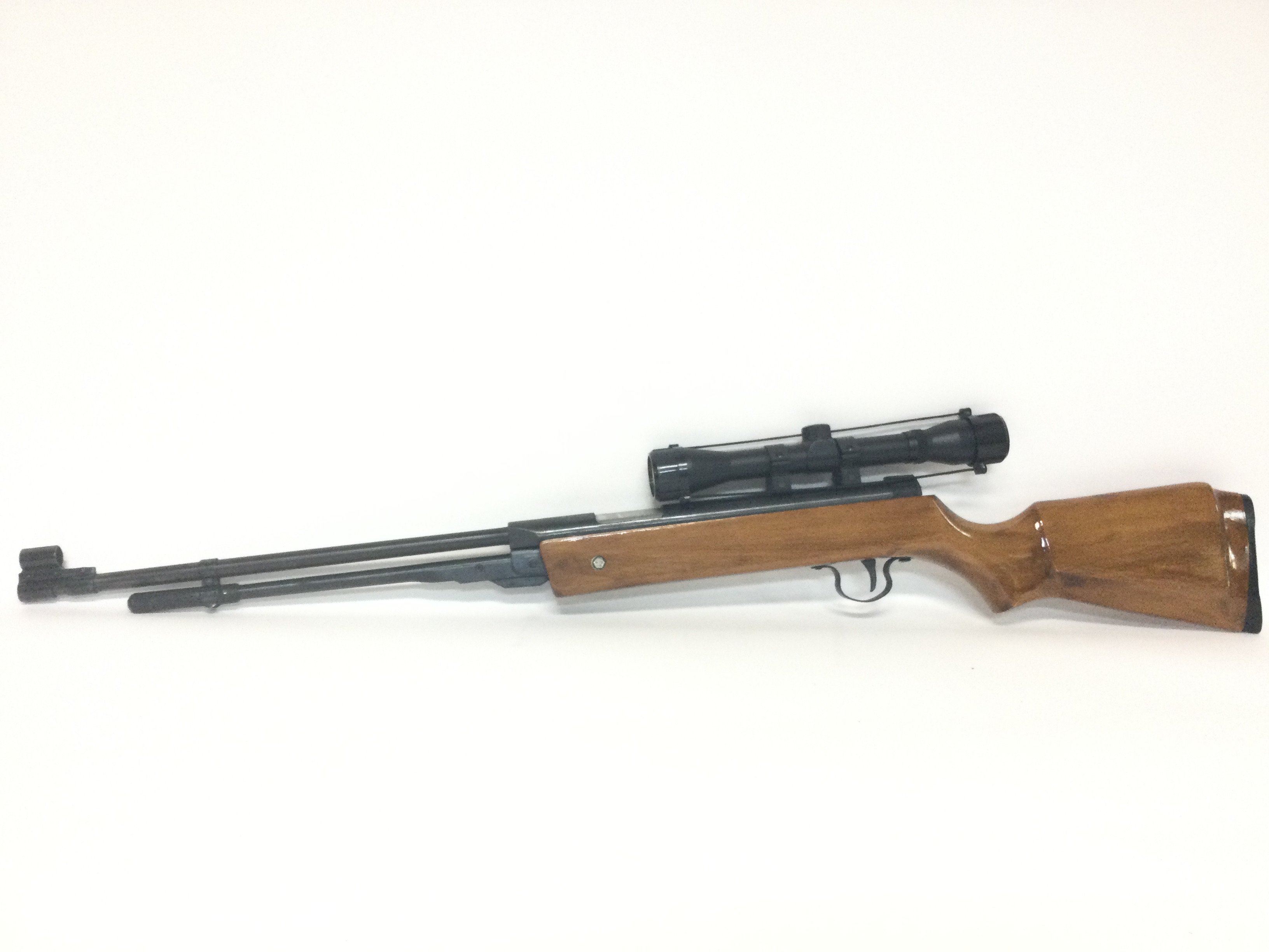 An unmarked air rifle with sight, including soft case and a boxed Dragon Claw Clamp on Bipod