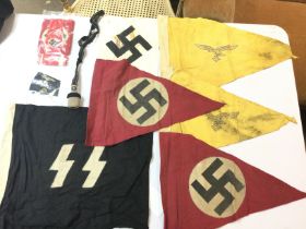 A collection of Third Reich flags, cloth badges and armbands. Postage category B