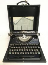 A cased Sterling Continental vintage typewriter , postage category C. NO RESERVE