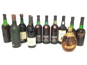 A collection of vintage ports and a bottle of dimple whisky. Port includes Dows Taylorâ€™s