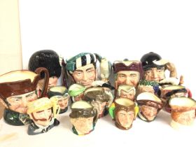 A collection of porcelain Royal Doulton Toby character jugs including Falstaff, Jester, Paddy,