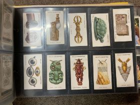 An Album with of sets of cigarette cards.